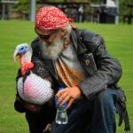 Photo by David Welton
South Whidbey resident Dan Weehunt has a word with Gertie, his 35-pound pet turkey, as they take a stroll in a park earlier this month.