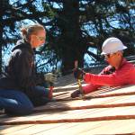 Volunteers build a roof in the style of the early 1900s on the Pratt Machine Shed in Ebeys Landing National Historical Reserve. (Photo by Karina Andrew/Whidbey News-Times)