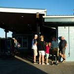 People gather before the playing of a movie at the Blue Fox Drive-In Theater in Oak Harbor. (Ryan Berry / The Herald)