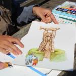 Photo by Karina Andrew/Whidbey News-Times
Nina Vichayapai shows her watercolor painting of the Story Pole at the Rosario Beach trailhead.