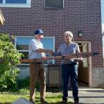 Photo provided
Mel Sheldon, right, presented Langley Mayor Scott Chaplin with an intricately carved and painted paddle Monday afternoon.