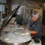 Carol Forgas boils bagels. (Photo by David Welton)