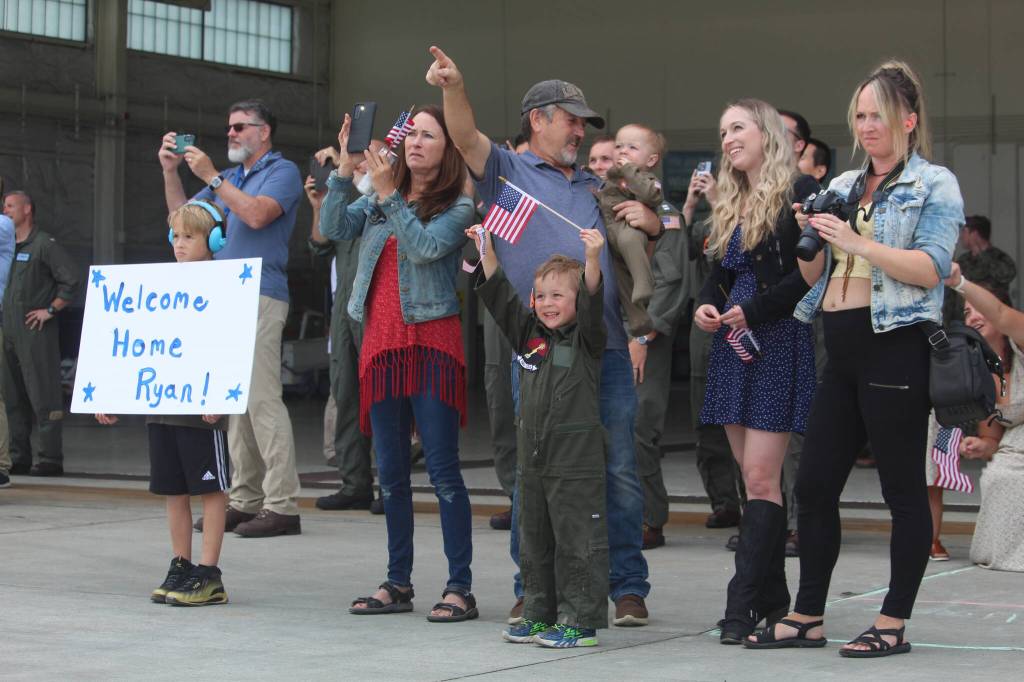 Friends and family members of returning aircrews eagerly await their loved ones landing at NAS Whidbey Island on Tuesday. (Photo by Karina Andrew/Whidbey News-Times)