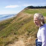 Lynn Hyde, director of Historic Whidbey, looks over Ebey's Landing where the history walk is taking place. (Phot by Rachel Rosen/Whidbey News-Times)