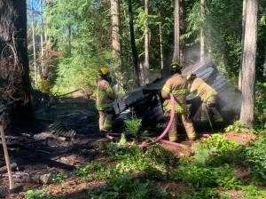 Photo provided
Firefighters from South Whidbey Fire/EMS responded Sunday to a fire in the woods behind the Bayview Cemetery.