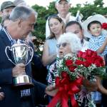 Darlyne Krieg receives the winning trophy at Longacres Mile. (Photo provided by Emerald Downs)