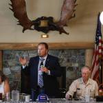 Photo by David Welton
Republican Tim Hazelo, a candidate for Island County commissioner, addresses attendees at a recent Old Goats  Fully Informed Voters luncheon. Left, Democrat and incumbent Janet St. Clair. Right, Rufus and Reece Rose, organizers of the discussion group.