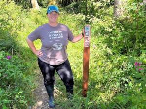 Photo by Harry Anderson
Whidbey Camano Land Trust Stewardship Director Jessica Larson stands before the new trailhead.