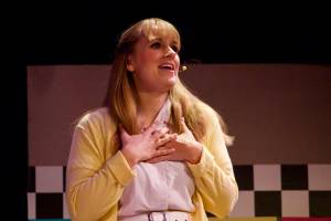 The Whidbey News-Times own Karina Andrew stars as Sandy, the sheltered ingenue who pines for greaser Danny throughout the show. (Photo by Rachel Rosen/Whidbey News-Times)