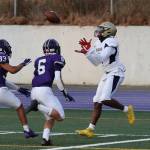 CJ McCreary catches a pass for a Wildcat score. (Photo by John Fisken)