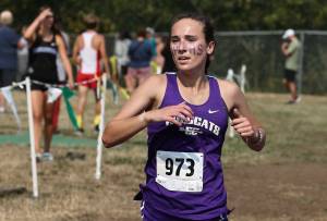 Photo by John Fisken
Oak Harbor High School runner Adrienne Root finished third overall in the 2 Miles Senior cross country race on Sept. 10 at the Sehome Invite at Bellinghams Civic Stadium. All three Whidbey Island schools participated. Her time was 12.09.99.