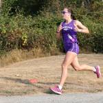 Photo by John Fisken
The Oak Harbor cross country girls team placed second at the first league meet of the year on Sept. 14 at the Skagit Regional Airport Trails in Burlington, scoring 42 against home Burlingtons 26. Oak Harbors Adrienne Root (pictured) won the girls 5,000 meters race easily, finishing in 19:07, over two minutes ahead of the second place runner. Oak Harbor Junior Claire Paul was fourth overall with a time of 22:25.
The Oak Harbor cross country boys team defeated host Burlington-Edison 26-43. Oak Harbors Jacob Pearson finished second in the boys 5,000 meters with a time of 16:29, followed by Taylen Bader in 3rd at 17:36.