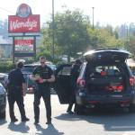 Photo by Karina Andrew/Whidbey News-Times
Oak Harbor police officers secure the scene of an arrest of a man who made a bomb threat Monday afternoon.