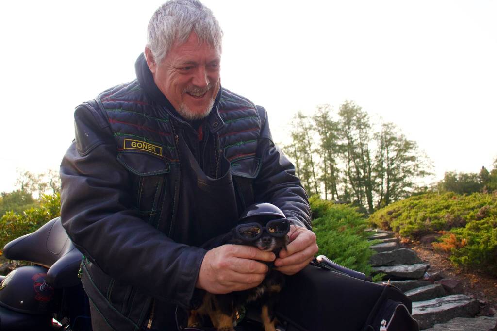 Photo by Rachel Rosen/Whidbey News-Times
Dwayne Goner Fletcher has a tiny helmet and sunglasses for his dog Gizmo who always rides in his jacket.