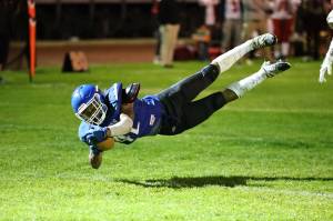 Photo by John Fisken
South Whidbey senior Cole Tschetter dives to the ground with the ball during a game against Kings on Oct. 14.