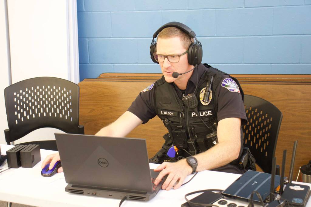 Photo by Rachel Rosen/Whidbey News-Times
Officer Todd Wilson controls the VR training scenario on a laptop and speaks to the trainees, acting as the virtual people, in their headphones.
