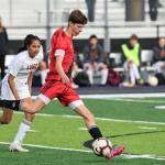 Junior Cole White kicks the ball during a game against Lopez Oct. 29. (Photo by John Fisken)