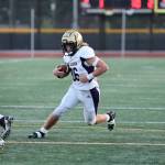 Aiden Finley runs during the playoff game at Edmonds Oct. 28. (Photo by John Fisken)