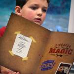 Dylan Gluckman-Oskin, 7, studies his kit of materials.