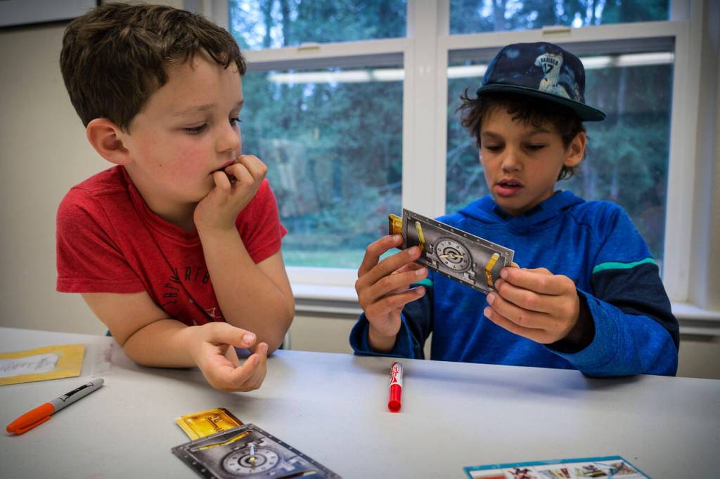 Miles Guggenheim, 9, right, attempts a trick while Dylan Gluckman-Oskin, 7, looks on.