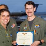 Capt. Eric Hanks, left, presents Petty Officer Justin Boyle with the Navy Marine Corps Medal Oct. 31.