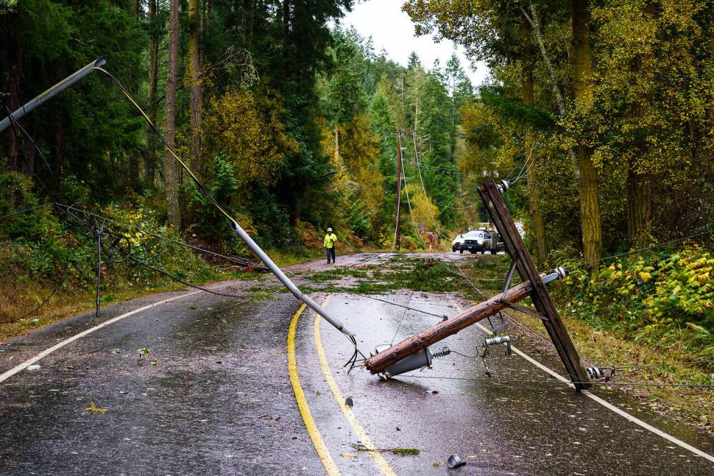 Photo by David Welton
Repair crews work to restore power to Whidbey Island after aggressive winds took out power lines and poles over the weekend.
