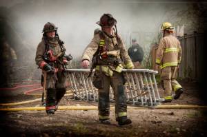 Photo by Cheryl Andersson 
Oak Harbor firefighters at a training burn in April of this year.