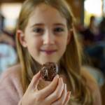 Photo by David Welton
Ciara Boyd holds up a chocolate thumbprint cookie made with Nutella, a variation of the classic vanilla thumbprint cookie with jam.