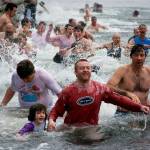 Photo by David Welton
Participants of the Polar Bear Plunge take an icy dip.