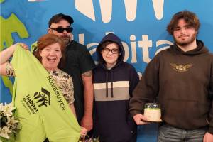 The family learns they've been accepted into the homebuyer program. Photo courtesy Habitat for Humanity