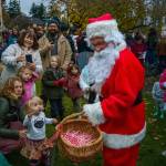 Photo by David Welton
Santa Claus (Mark Stewart Cassidy) made a trip to the Village by the Sea this year. On Saturday, during the citys Lighting of Langley event, the jolly big red man arrived just after sunset and handed out oodles of candy canes to excited children. A group of musicians led the crowd gathered in singing Christmas carols.