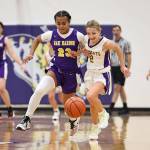 Photo by John Fisken
From left, Oak Harbor basketball players Zoe Scott and Annalise Wesley chase the ball during a scrimmage at Night Out with the Cats Saturday.
