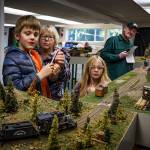 Photo by David Welton
Melene Thompson, with grandkids Lucas and Alexa, watch a model train go by.