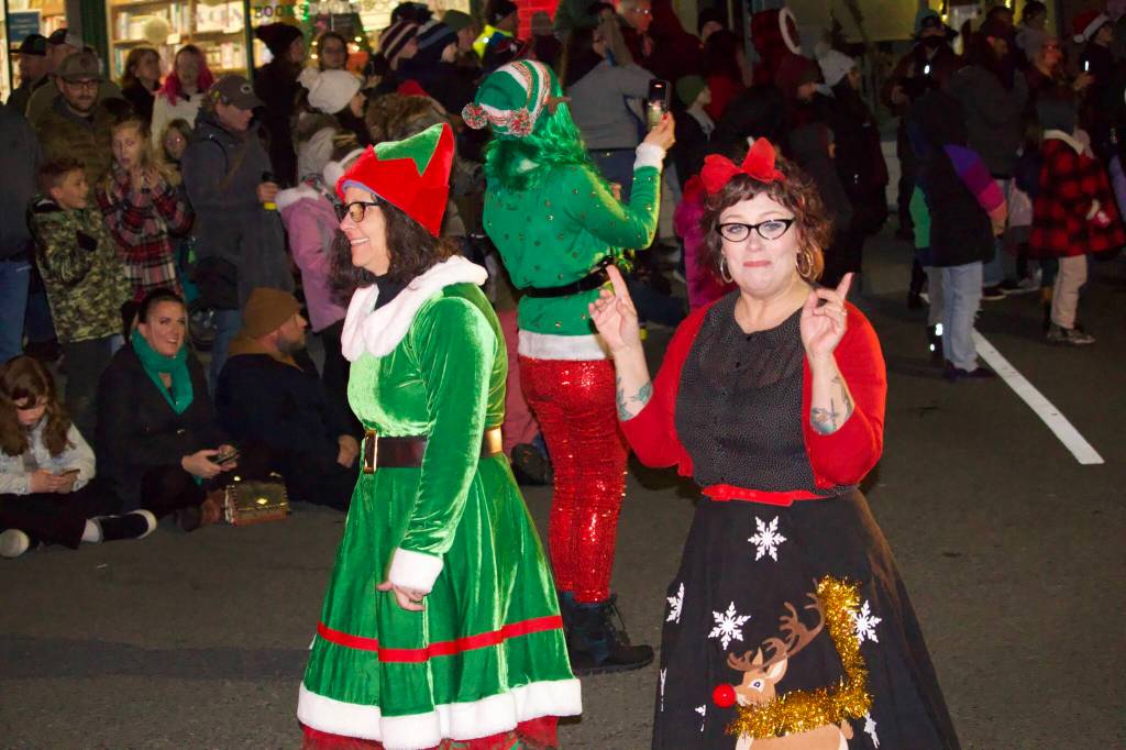 Photo by Rachel Rosen/Whidbey News-Times
Two elves precede Santa and Mrs. Claus during Oak Harbors Christmas parade.