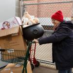 Photo provided
A volunteer wheels a cart full of donations into Holiday House.