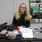 Photo by Rachel Rosen/Whidbey News-Times
Garage of Blessings volunteer Jane Brent organized one of the nonprofits holiday events this year. She handed out brand new scarves, hats, gloves and other clothing needed for winter.