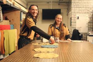 Photo by Karina Andrew/Whidbey News-Times
Shea Looijen, left, and Kristi Uhles assemble their house made pouch games, many of which are recreations of ancient games that have been all but lost over the centuries.