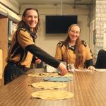 Photo by Karina Andrew/Whidbey News-Times
Shea Looijen, left, and Kristi Uhles assemble their house made pouch games, many of which are recreations of ancient games that have been all but lost over the centuries.