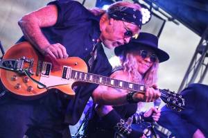 Photo by Dennis Browne
Joe Reggiatore is the guitarist for the T.Rust Band. He and Janie Cribbs are partners in life and in music.