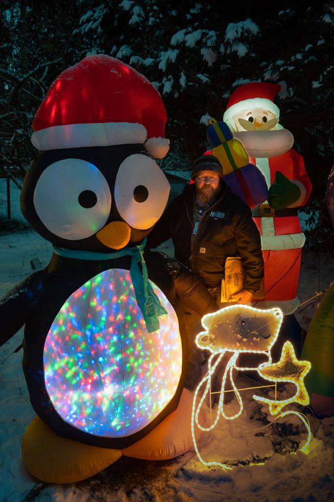 Clinton resident Jim Young is known around his neighborhood for his inflatable holiday decorations. (Photo by David Welton)