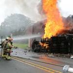 North Whidbey Fire and Rescue firefighters battle a blaze at Penn Cove Pottery after a semi truck crashed into the historic building in June. (Photo by John Fisken)