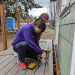 Photo provided
Masyn Eberhardy and Jack Rafferty from Oak Harbor build a deck for one of the tiny homes in Langley.