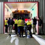 Photo provided
North Whidbey Fire and Rescue firefighters push one of two new engines into its new home at Station 25.