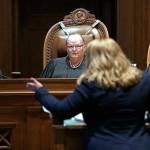 FILE - In this June 11, 2019 file photo, Justice Charles Johnson, left, Chief Justice Mary Fairhurst, center, and Justice Barbara Madsen, right, listen as Michele Earl-Hubbard, an attorney for a media coalition led by The Associated Press, speaks during a hearing before the Washington Supreme Court in Olympia, Wash., regarding a case that will determine whether state lawmakers are subject to the same disclosure rules that apply to other elected officials under the voter-approved Public Records Act. The Washington Supreme Court ruled Thursday, Dec. 19 that the Public Records Act does fully apply to state lawmakers by a 7 to 2 decision. (AP Photo/Elaine Thompson, File)