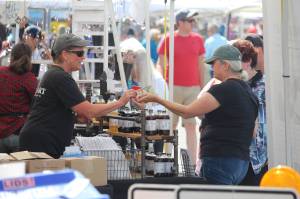 File photo by Karina Andrew/Whidbey News-Times
A Coupeville Arts and Crafts Festival patron purchases goods from a local vendor at the 2022 festival.