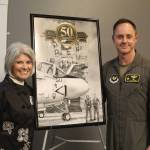 Photo by Karina Andrew/Whidbey News-Times
Tonya Clark and her son, Brigadier General Tad Clark, receive a painting of their husband and father, bombardier Robert Clark, with his pilot, Michael McCormick, who were shot down over North Vietnam in 1973.