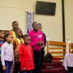 Nicole Rice, at right, leads a rehearsal for the annual Martin Luther King Jr. event at the House of Prayer. (Photo by Rachel Rosen/Whidbey News-Times)
