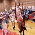 Coupeville junior Logan Downes takes a shot in a varsity basketball game against Mount Vernon Christian on Tuesday. Downes scored a total of 28 points for the Wolves during the Jan. 10 game. The Wolves won 44-39, bringing their record to 6-5 for the season. (Photo by John Fisken)