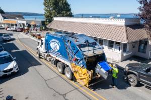 Photo provided
An Island Disposal truck services Village Pizzeria in downtown Langley.