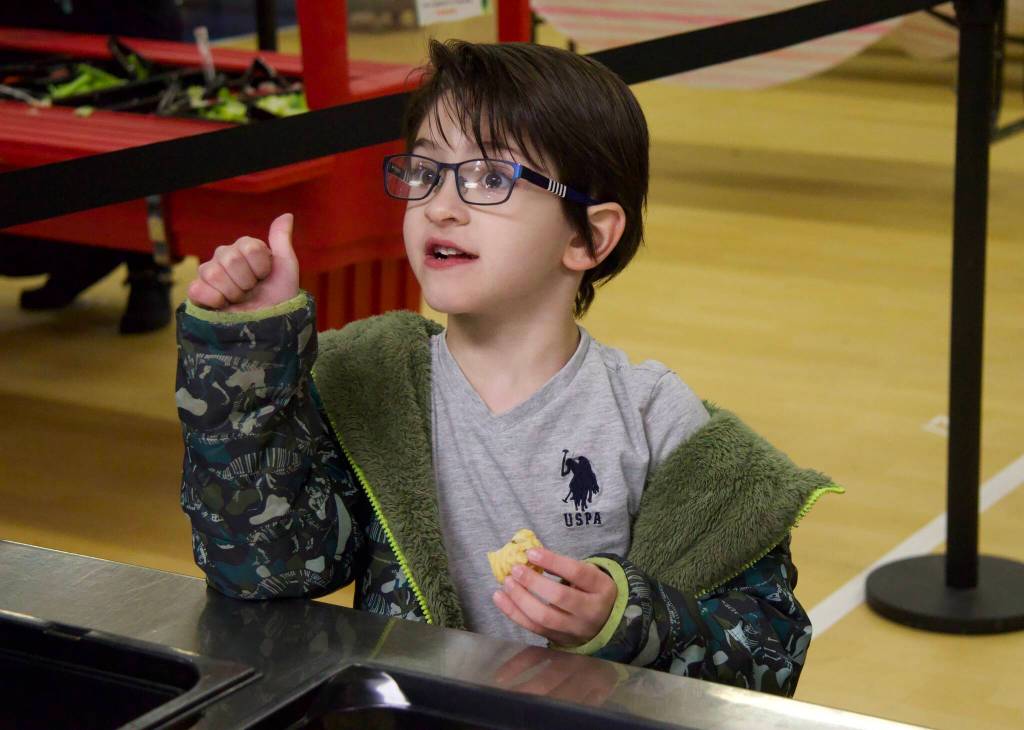 Photo by Rachel Rosen/Whidbey News-Times
Logan Paradesi approves of mashed radishes, the produce featured in Februarys Harvest of the Month.